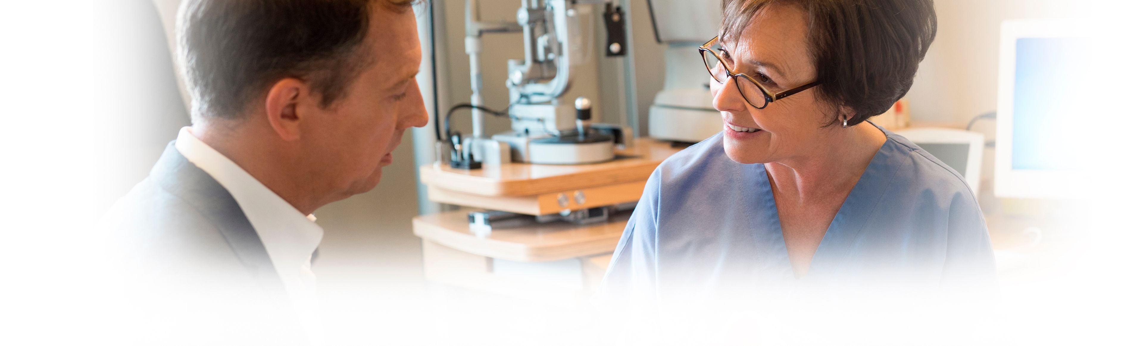 A female doctor explains a procedure to a patient